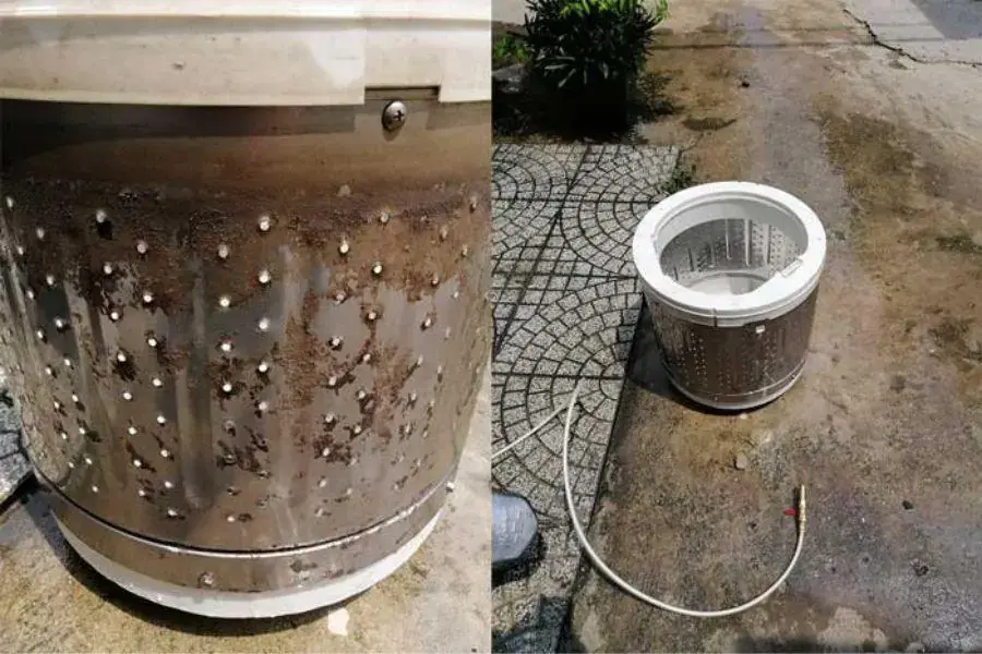 Tháo rời lồng giặt đứng trước khi tiến hành vệ sinh