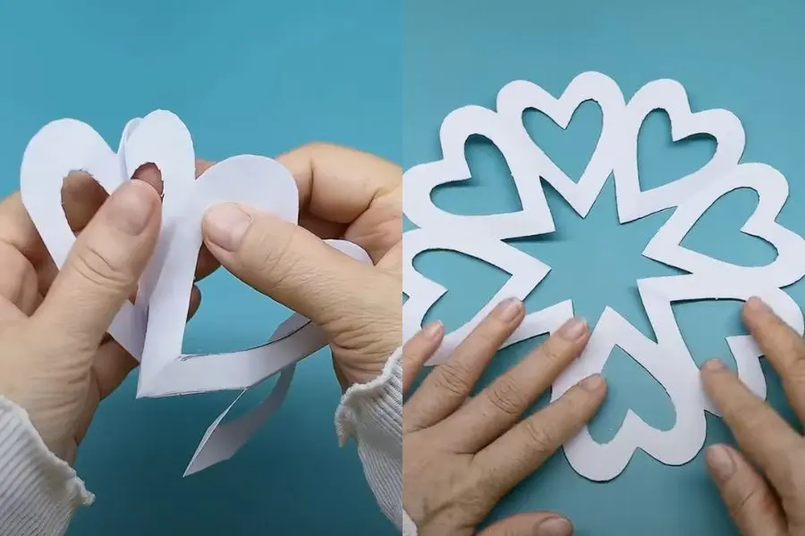 Cắt xong, mở giấy ra sẽ hiện lên hình bông tuyết trang trí Noel.
