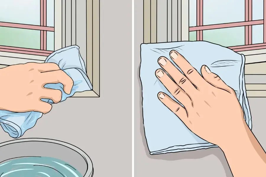 Làm sạch cửa kính bằng nước ấm và giẻ lau.