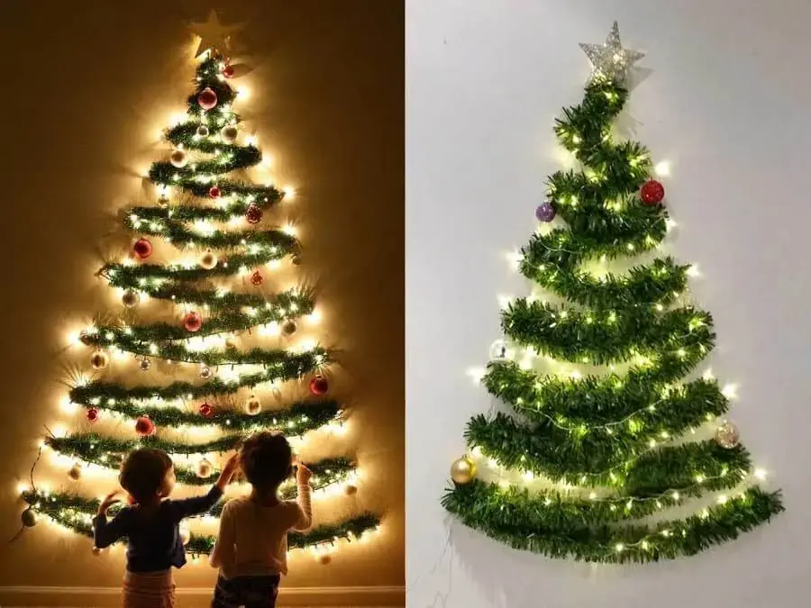 Sử dụng dây kim tuyến xanh để trang trí cây thông Noel trên tường nhà.