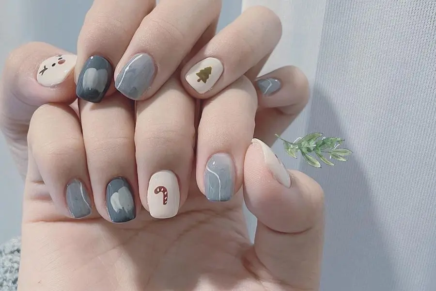 Nail Noel pha màu loang tôn lên sự trẻ trung và sang chảnh.