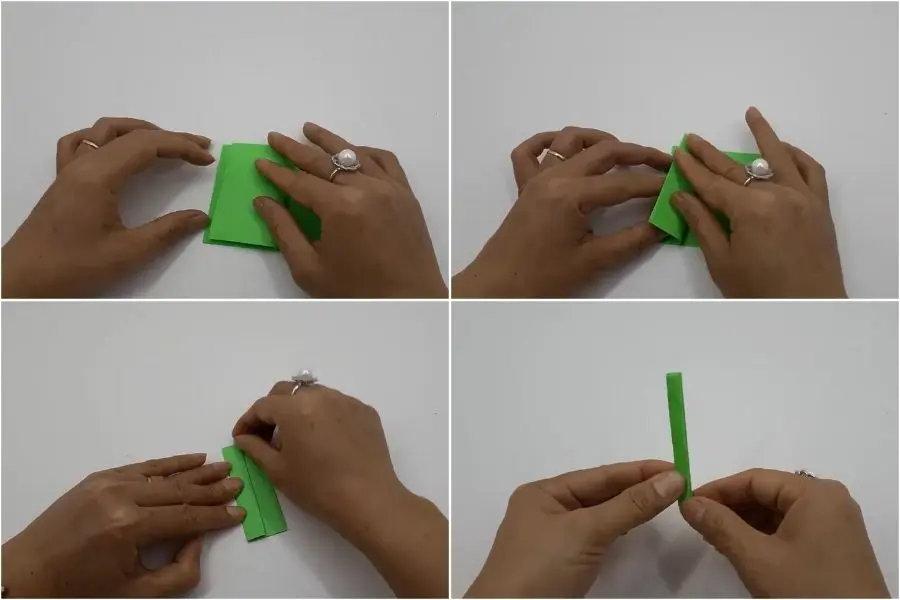 Bạn gấp tờ giấy màu xanh ra ngoài mỗi bên 4 lần để tạo nếp đều nhau.