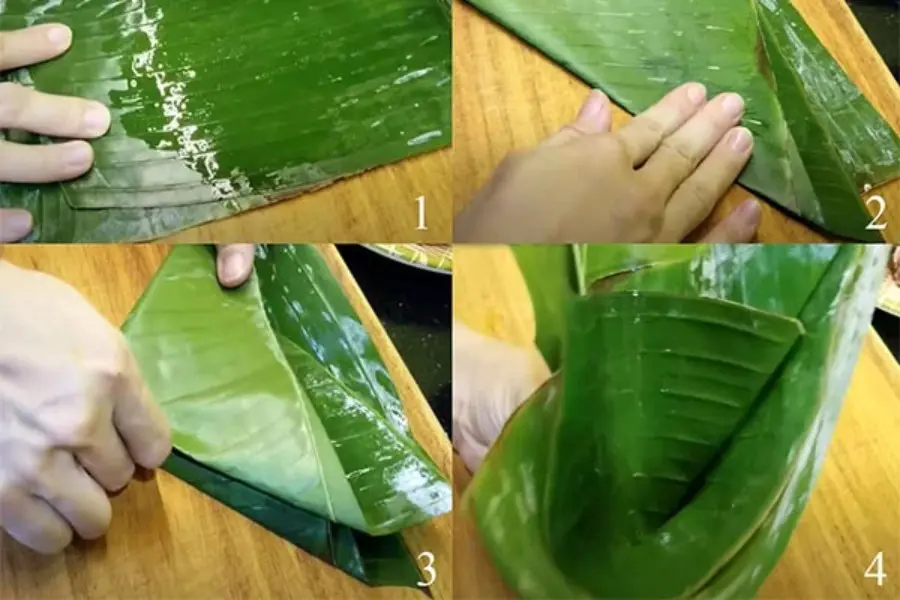 Làm ướt lá chuối.
Gấp mép lá chuối thành hình phễu